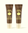 Two Sun Bum Lip 30 Duo: Clear + Clear coconut lip balms with SPF 30 in brown tubes on a white background