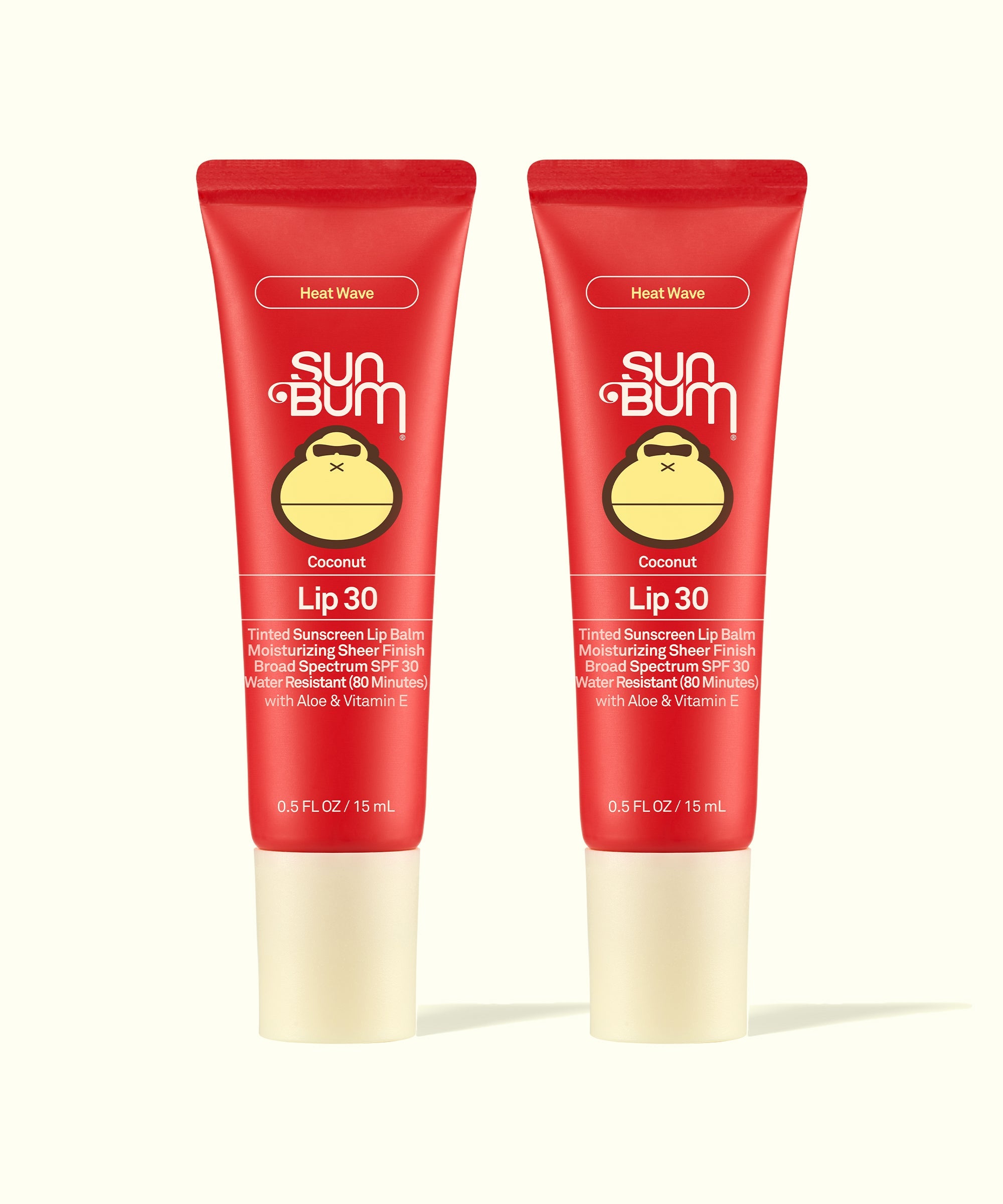 Two Sun Bum Heat Wave tinted lip balms in red tubes with beige caps shown side by side for Tinted Lip Duos.