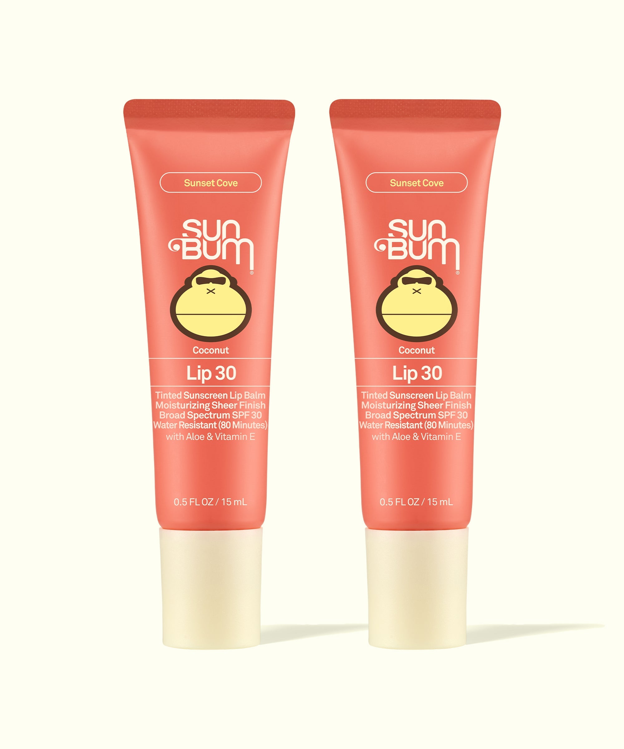 Two Sun Bum Sunset Cove Coconut Lip 30 tinted sunscreen lip balms in coral packaging, part of Tinted Lip Duos